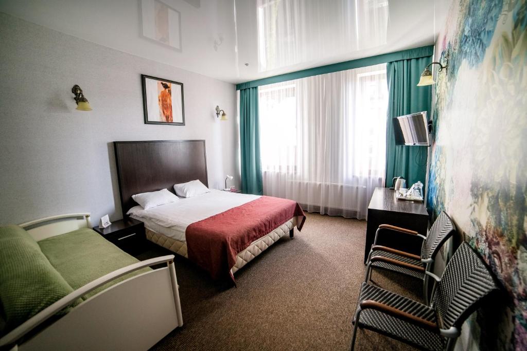 Postel nebo postele na pokoji v ubytování Hotel Solomiya