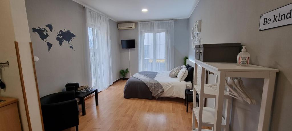 Posteľ alebo postele v izbe v ubytovaní Laura Home
