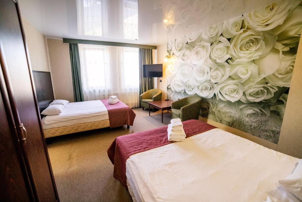 Postel nebo postele na pokoji v ubytování Hotel Solomiya