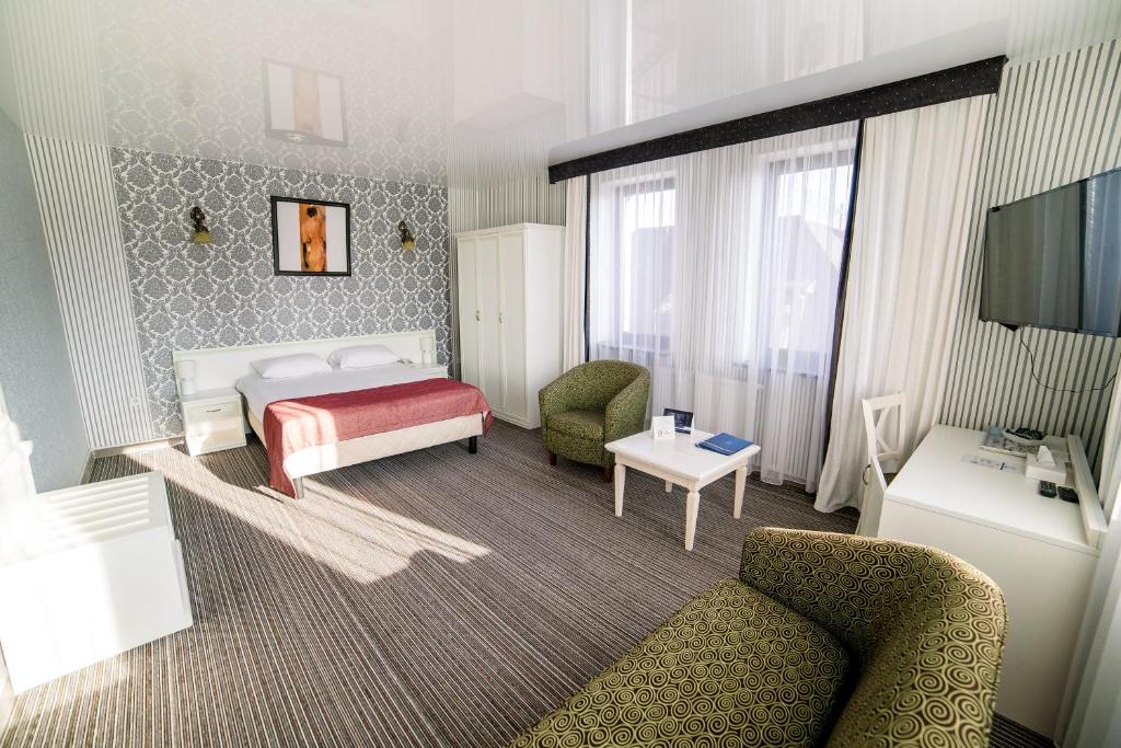 Postel nebo postele na pokoji v ubytování Hotel Solomiya