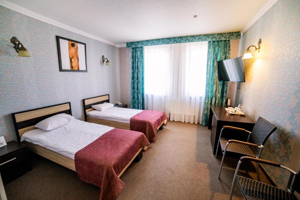 Postel nebo postele na pokoji v ubytování Hotel Solomiya