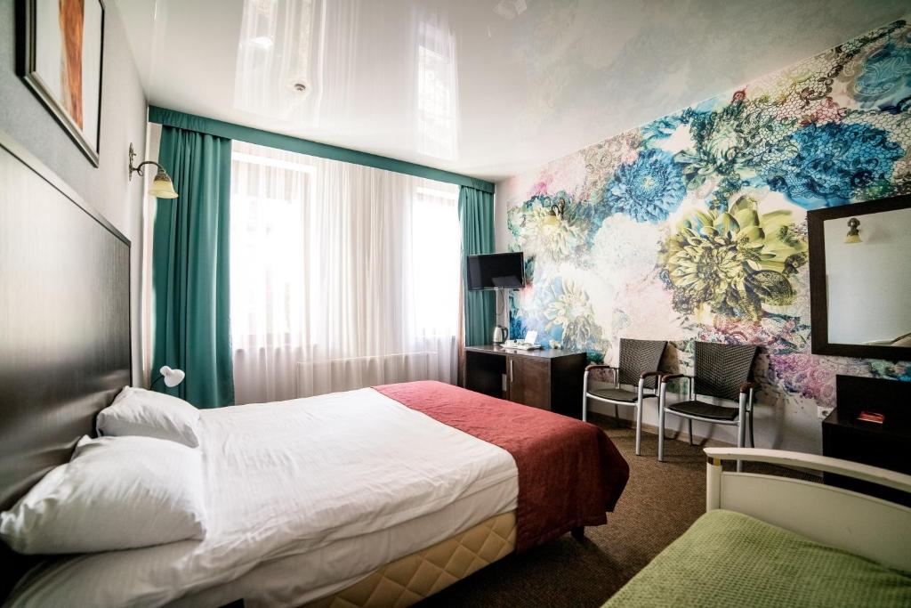 Postel nebo postele na pokoji v ubytování Hotel Solomiya