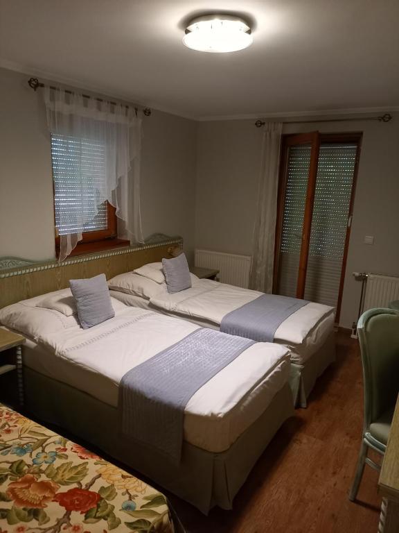 Postel nebo postele na pokoji v ubytování Mézesvölgy Vendégház