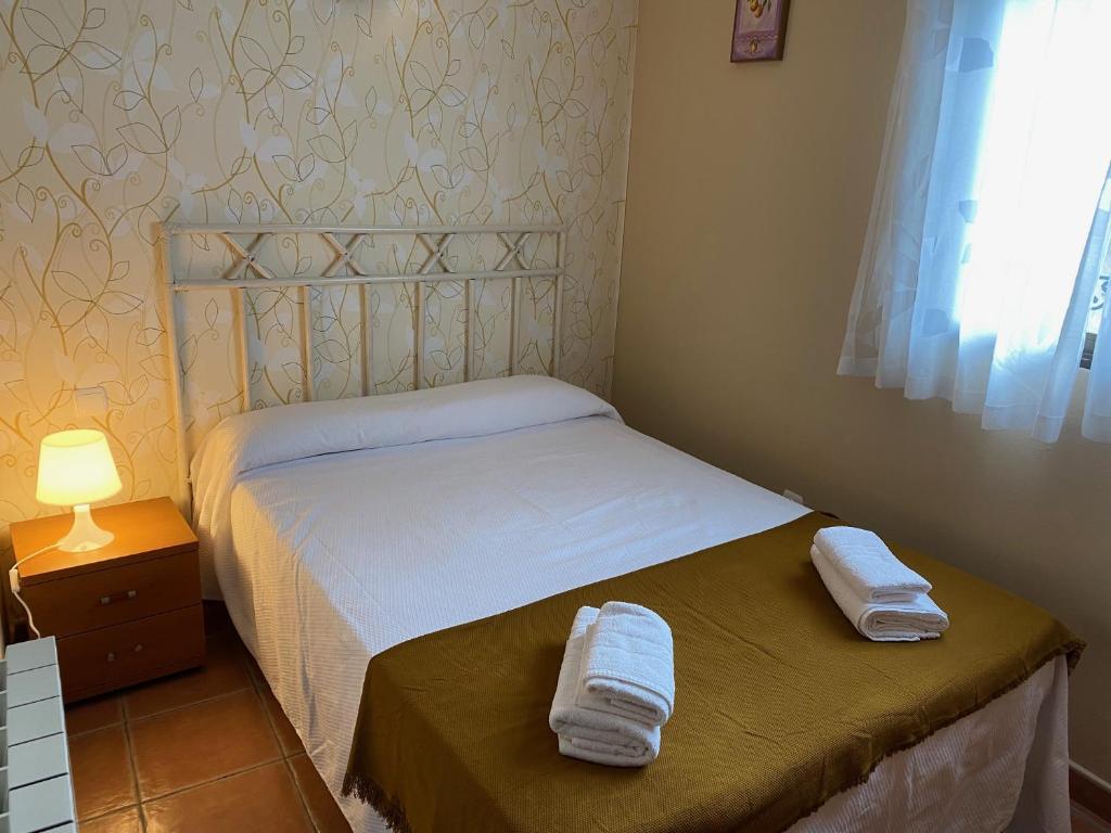 Postel nebo postele na pokoji v ubytování Apartamentos Rurales "La Fuentecilla"