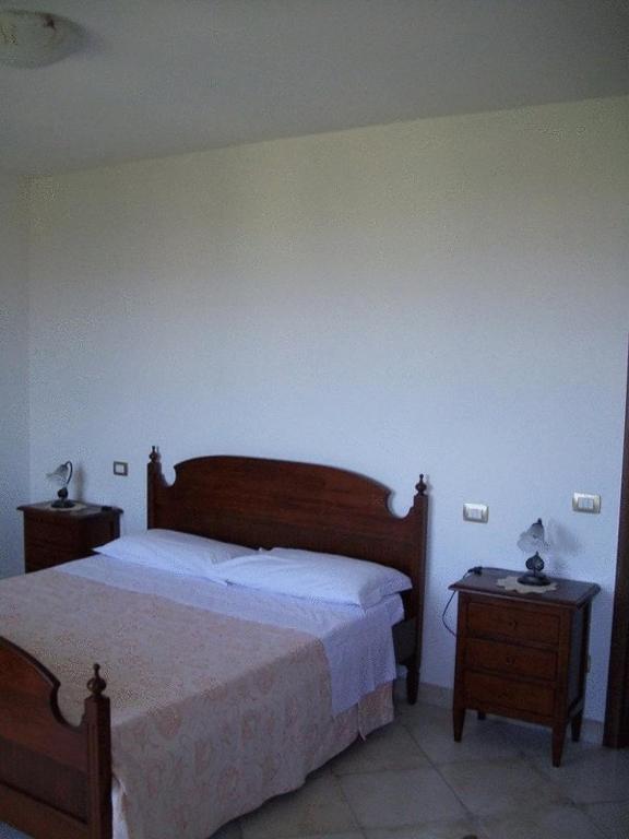 Postel nebo postele na pokoji v ubytování La Collina Del Sagrantino