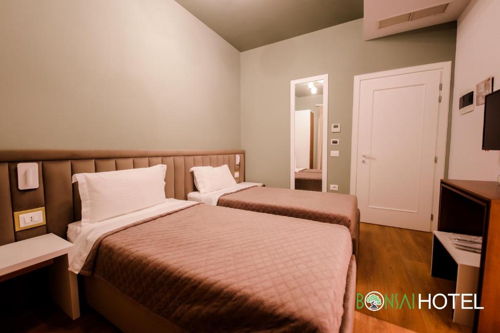 Postel nebo postele na pokoji v ubytování Hotel Bonsai