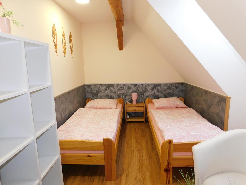 Postel nebo postele na pokoji v ubytování Apartmány Brychovi