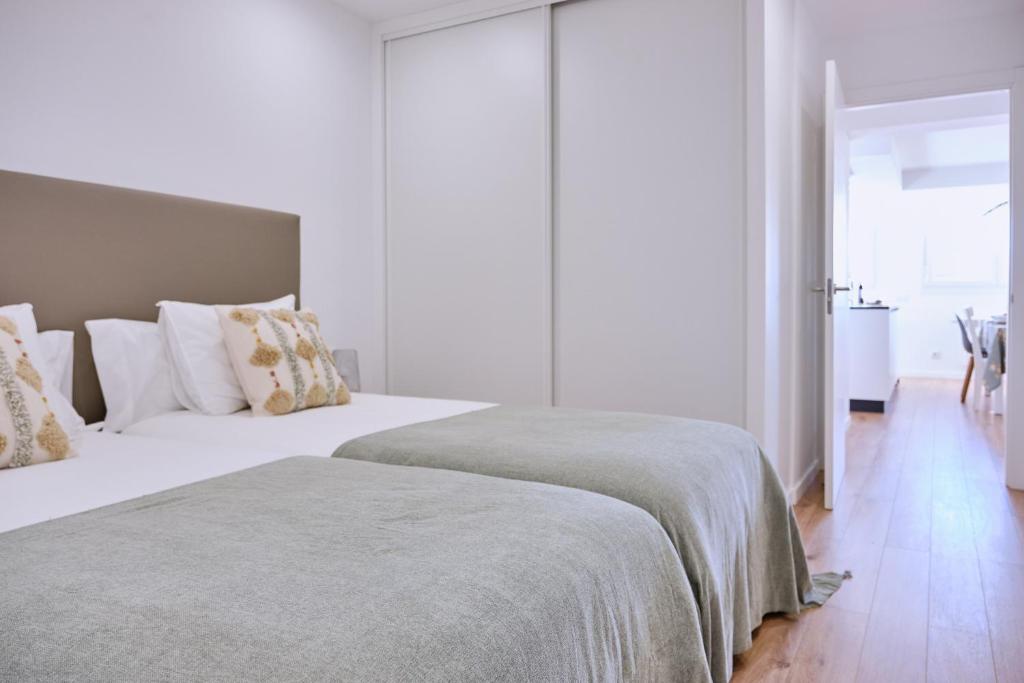 A bed or beds in a room at Apartamento San Pedro