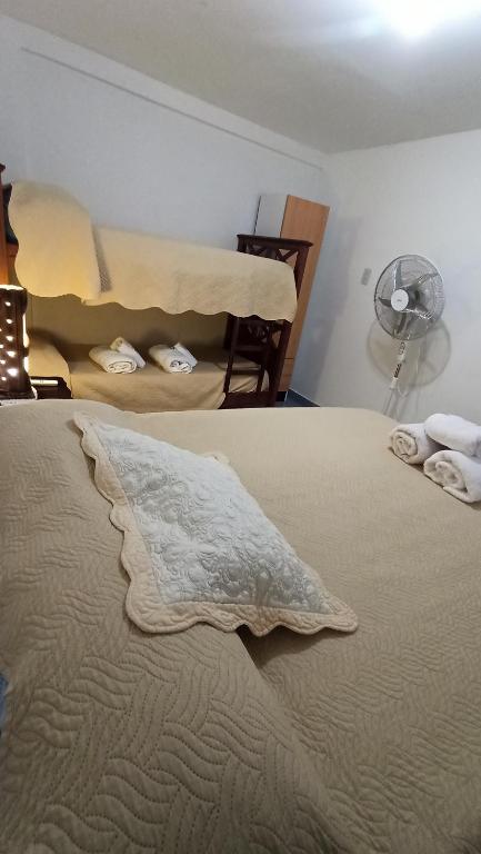 a bedroom with a bed with a pillow on it at Apart termas in Termas de Río Hondo