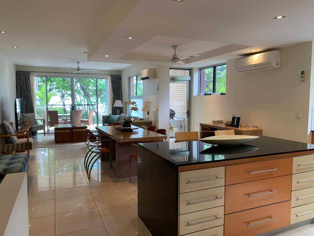 a kitchen with a large island with a counter top at Beach House Apartment 1 in Mission Beach