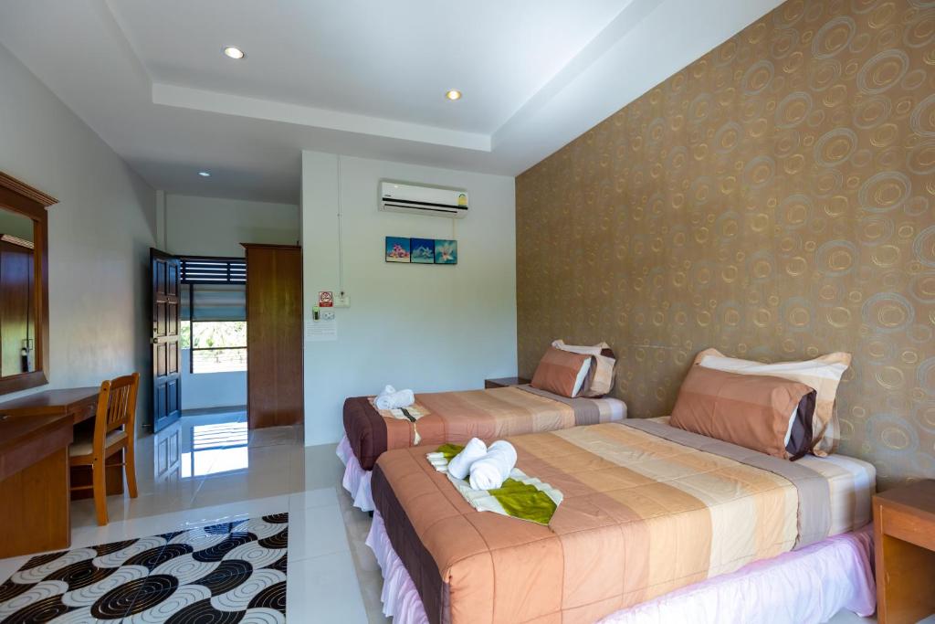 Ein Bett oder Betten in einem Zimmer der Unterkunft Nature Line Resort