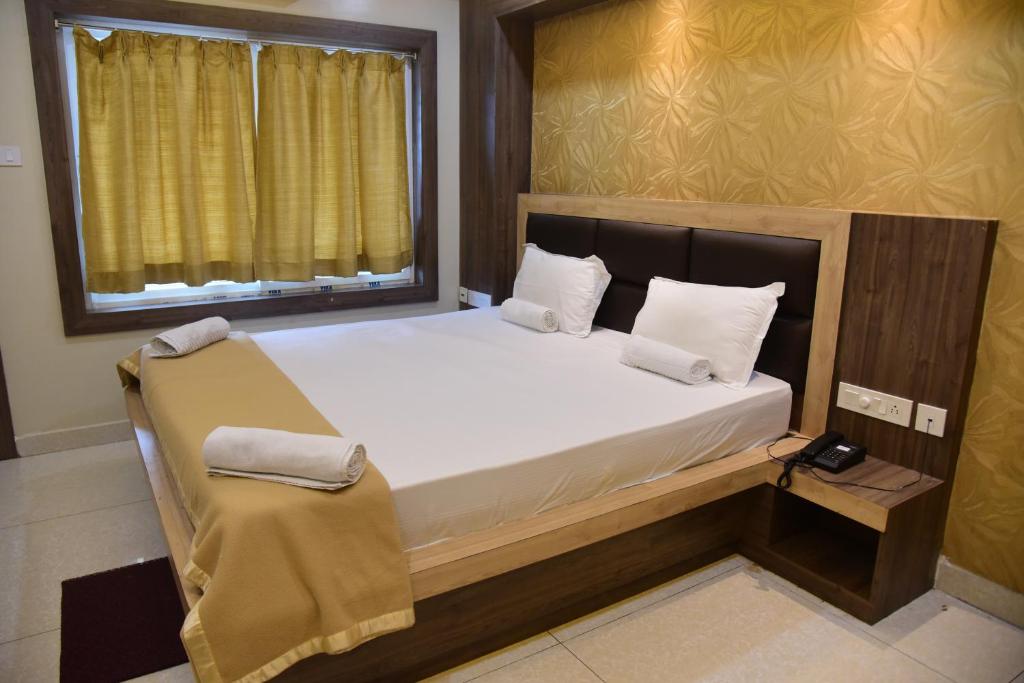 Postel nebo postele na pokoji v ubytování Hotel Guru Estate