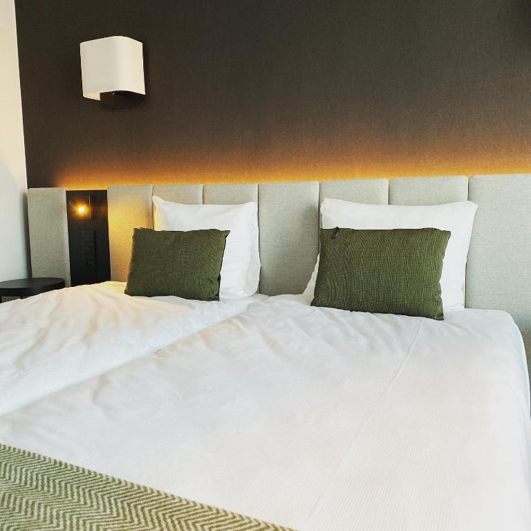 Postel nebo postele na pokoji v ubytování Factory Hotel