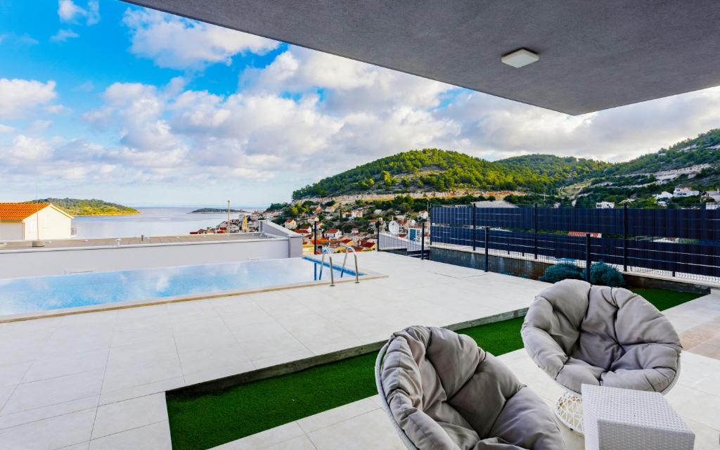 a view of the ocean from the roof of a house at Luxury Blue Villas Vis in Vis