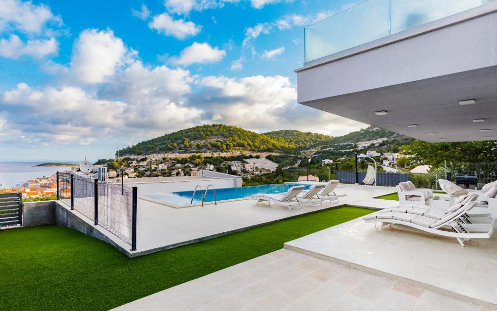 a house with a view of the ocean at Luxury Blue Villas Vis in Vis
