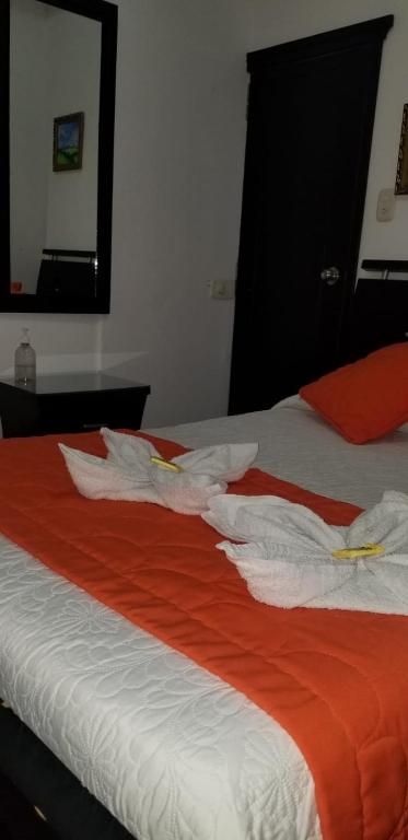 Postel nebo postele na pokoji v ubytování Hospedaje El Buen Descanso