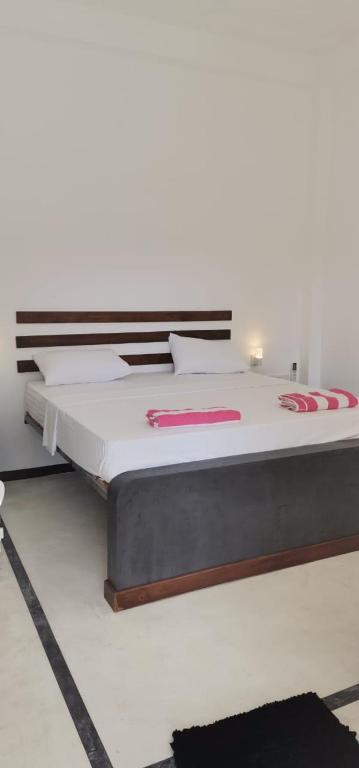 Postel nebo postele na pokoji v ubytování Petit Guest House
