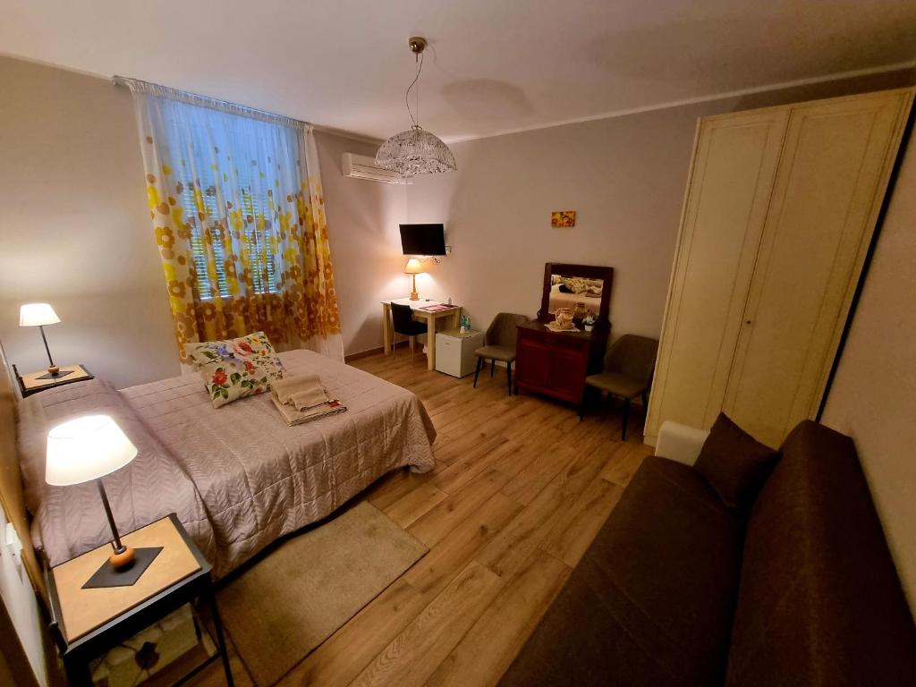 Ένα ή περισσότερα κρεβάτια σε δωμάτιο στο Il Casale nel Parco Guesthouse