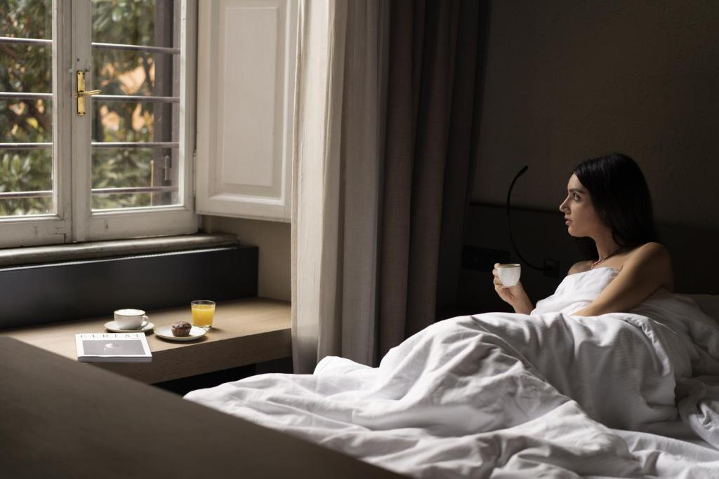 Postel nebo postele na pokoji v ubytování Hotel dei Barbieri