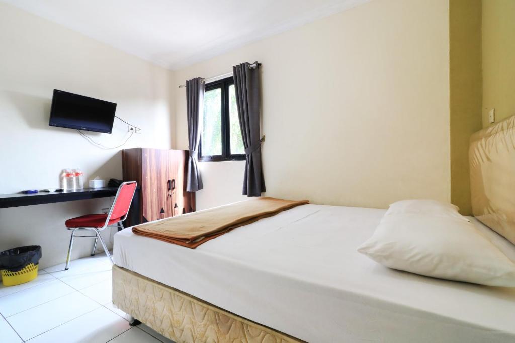 Postel nebo postele na pokoji v ubytování AMS Hotel Koja