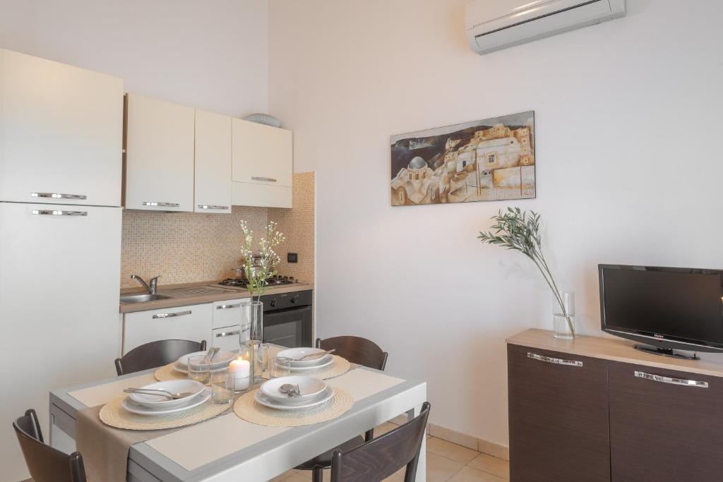 Kuchyň nebo kuchyňský kout v ubytování Residence Le Fontane