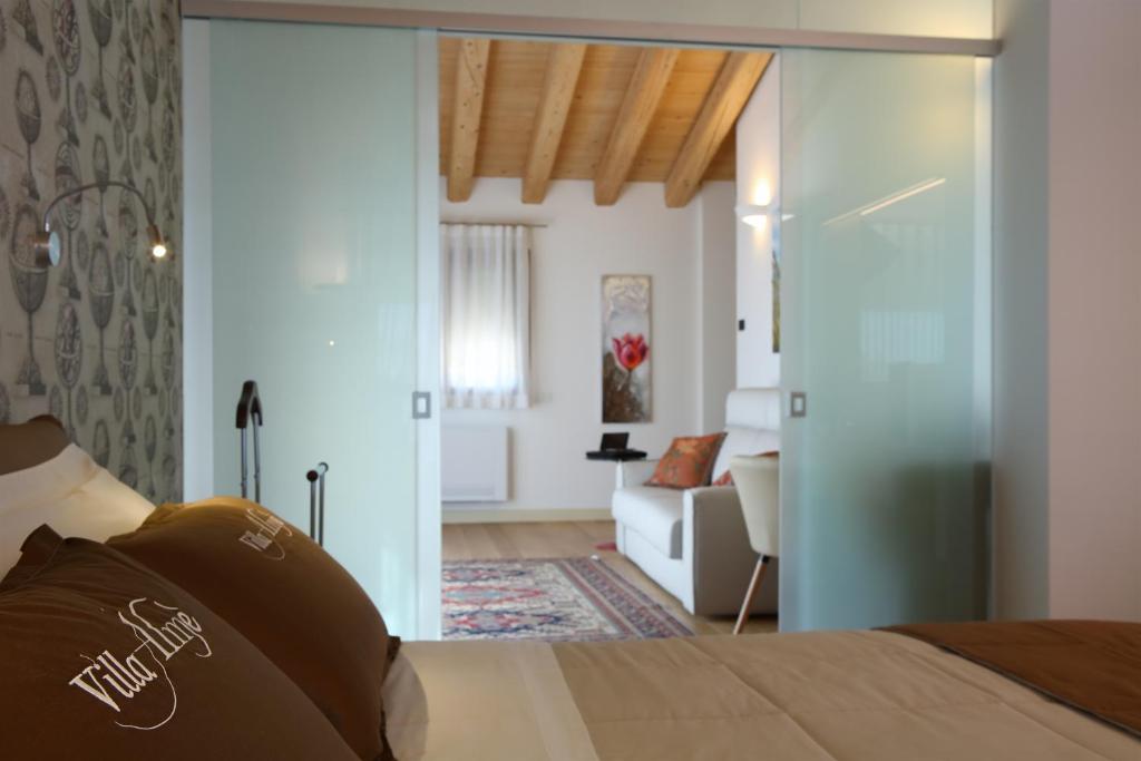 Postel nebo postele na pokoji v ubytování Agriturismo Villa Almè