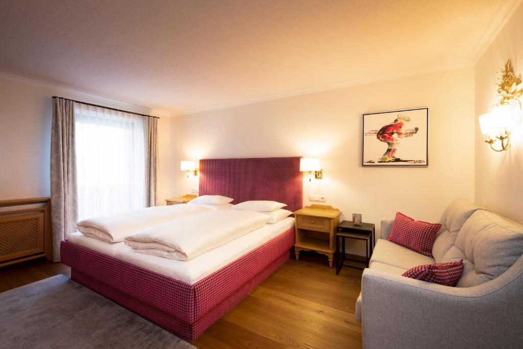 Postel nebo postele na pokoji v ubytování Hotel Garni Edelweiss