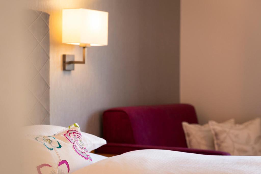 Postel nebo postele na pokoji v ubytování Hotel Garni Edelweiss