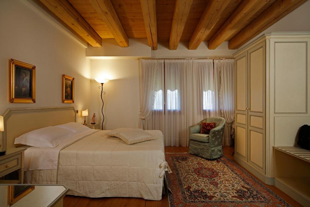 Postel nebo postele na pokoji v ubytování Agriturismo Villa Almè