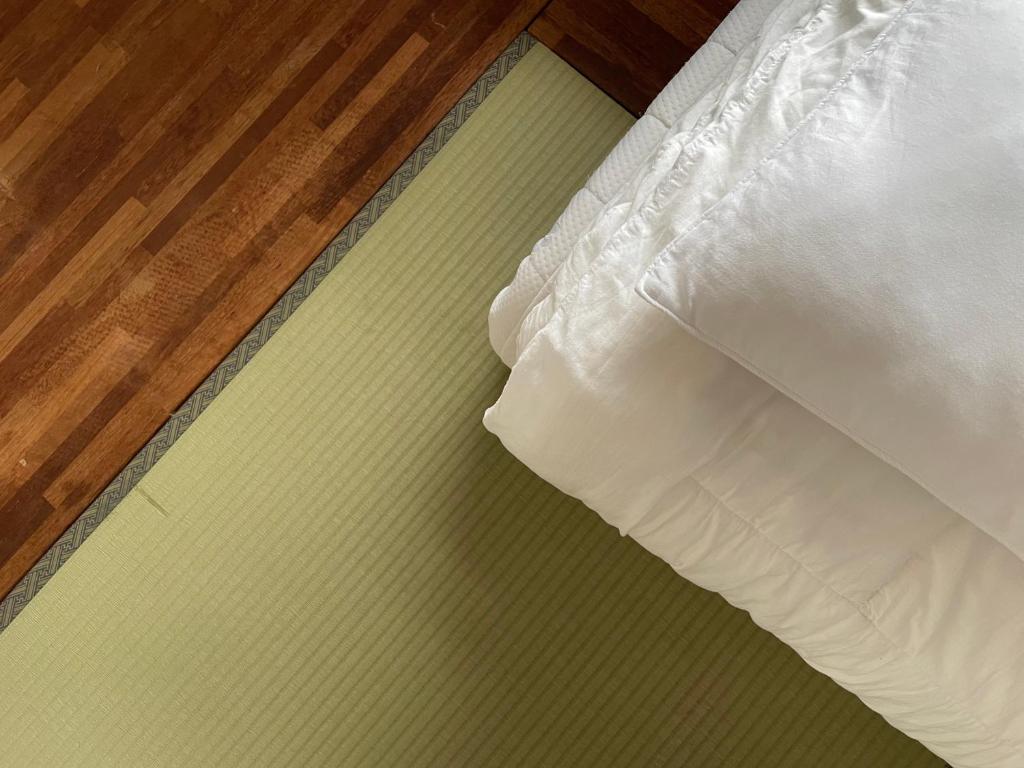 Postel nebo postele na pokoji v ubytování Hwadam Inn