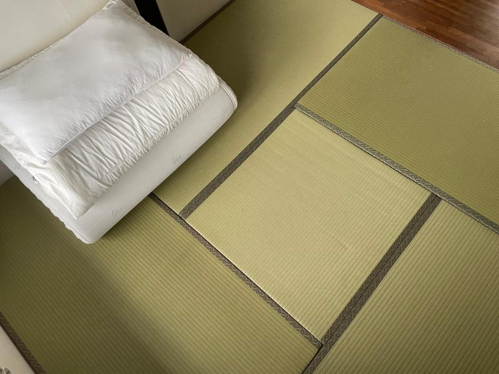 Postel nebo postele na pokoji v ubytování Hwadam Inn