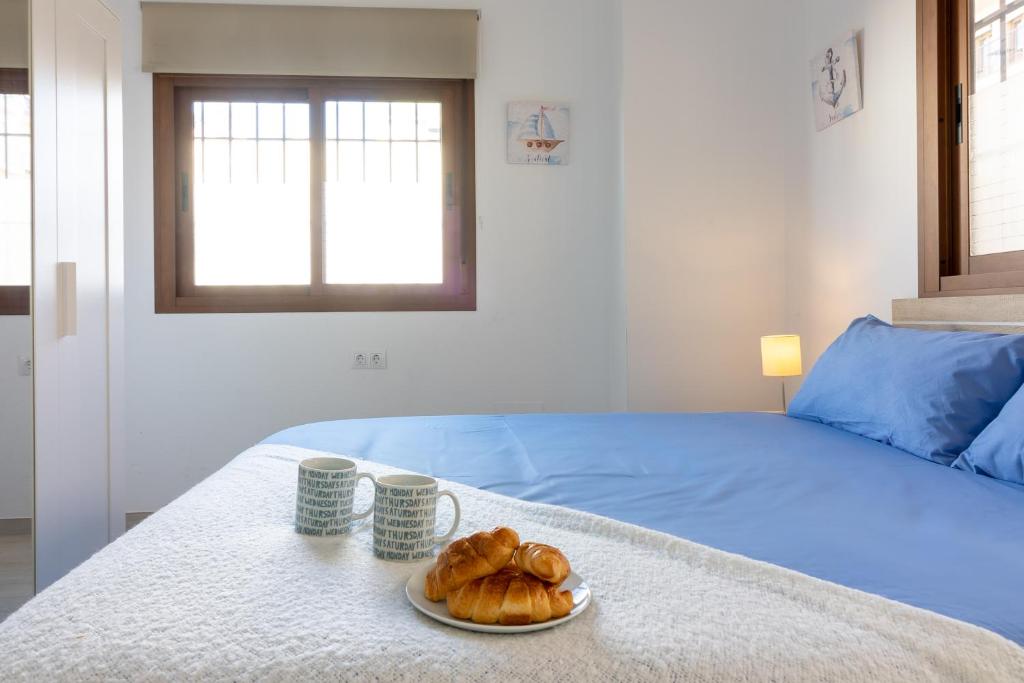 Posteľ alebo postele v izbe v ubytovaní Santa María FreshApartments