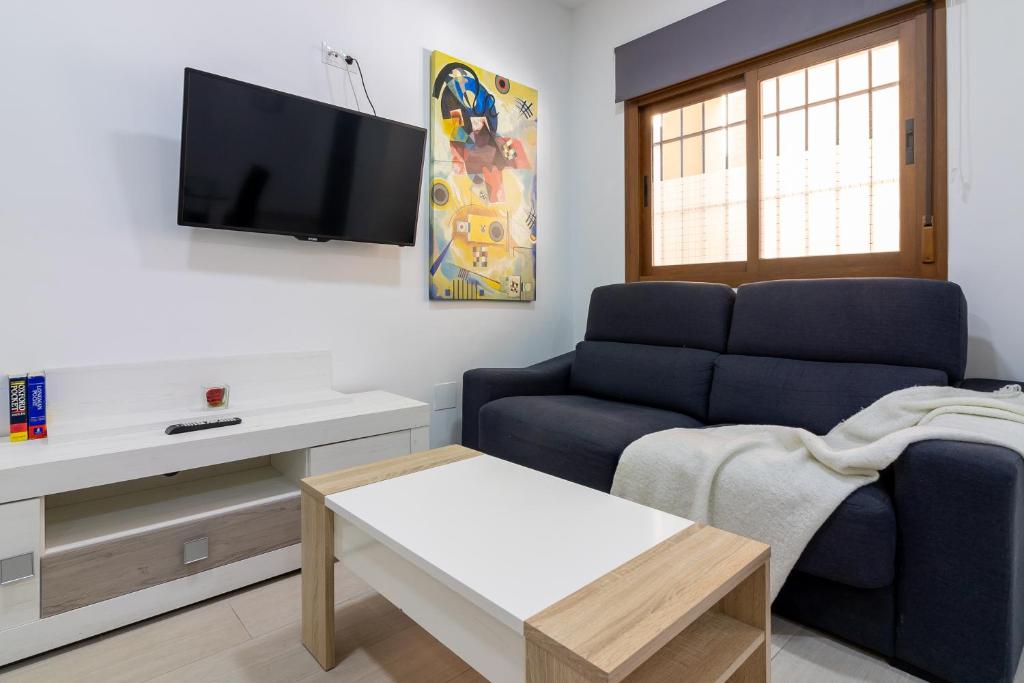 Televízia a/alebo spoločenská miestnosť v ubytovaní Santa María FreshApartments