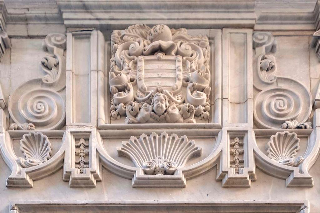 a building with a carving on the side of it at Áurea Casa Palacio Sagasta by Eurostars Hotel Company in Cádiz