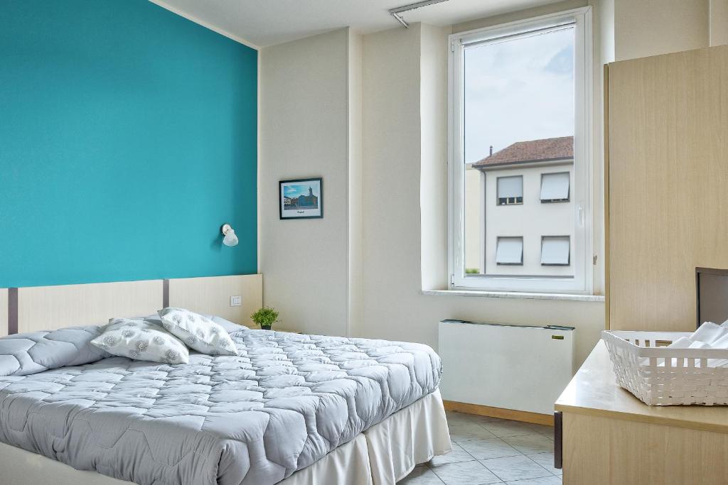 Ένα ή περισσότερα κρεβάτια σε δωμάτιο στο Affittacamere de’ Cappuccini