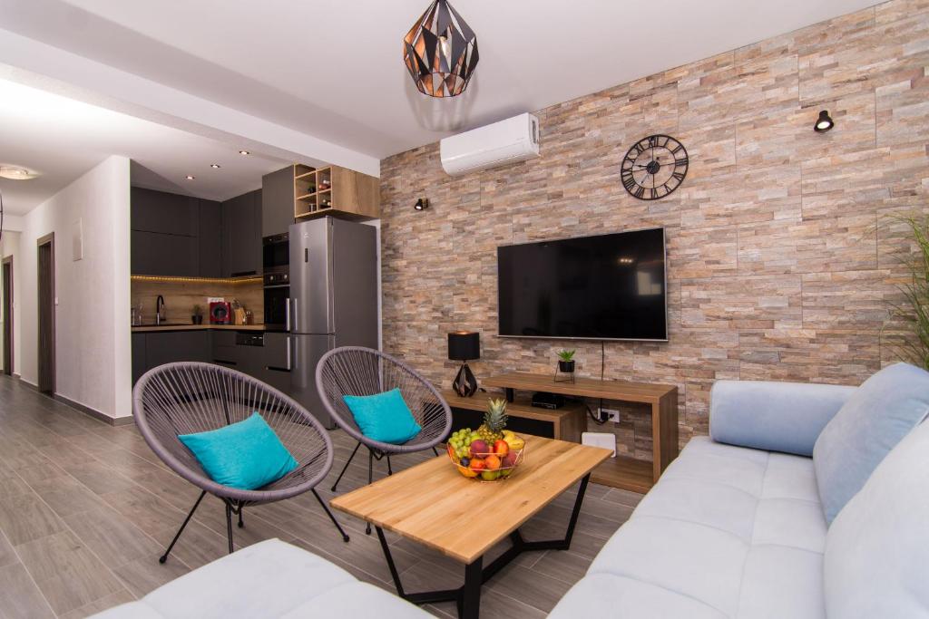 TV a/nebo společenská místnost v ubytování Apartment Sunset