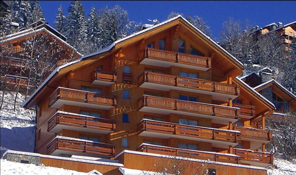 a large building with snow on the ground at Newly renovated 7-9pers Luxury Chalet in Meribel Centre 85m2 3BR 3BA with stunning Mountain View in Méribel