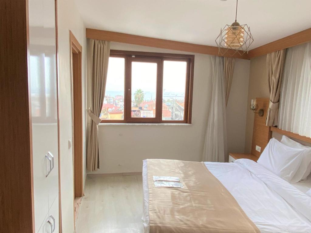 Postel nebo postele na pokoji v ubytování Zeyn Otel Istanbul