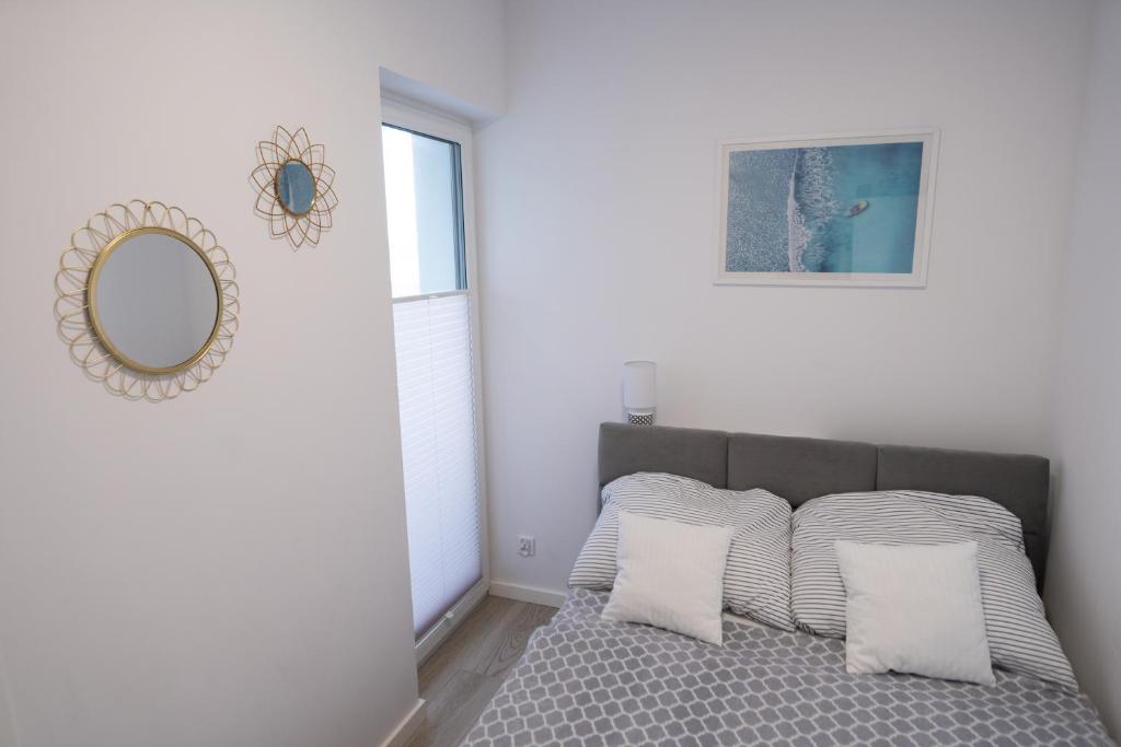 Posteľ alebo postele v izbe v ubytovaní Apartament Pastelove Kołobrzeg