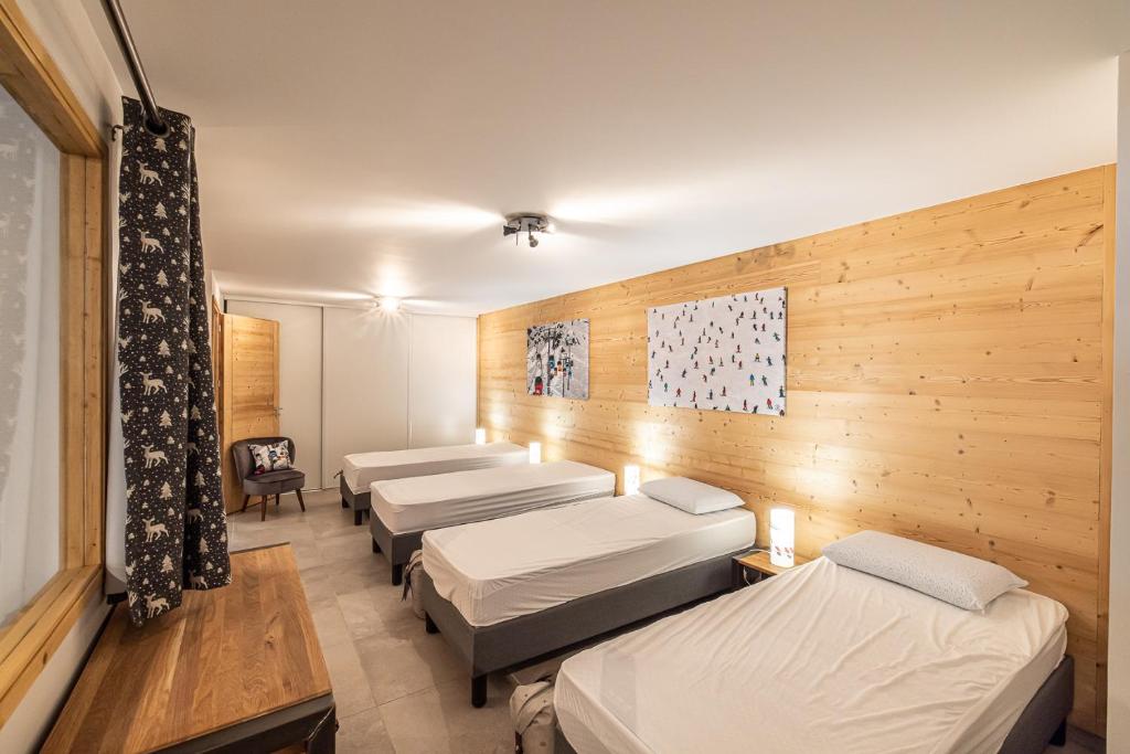Una cama o camas en una habitaci&oacute;n de Le Loft Alpin