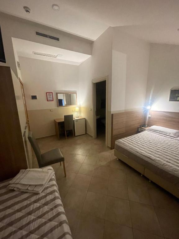 Postel nebo postele na pokoji v ubytování Hotel Montecarlo