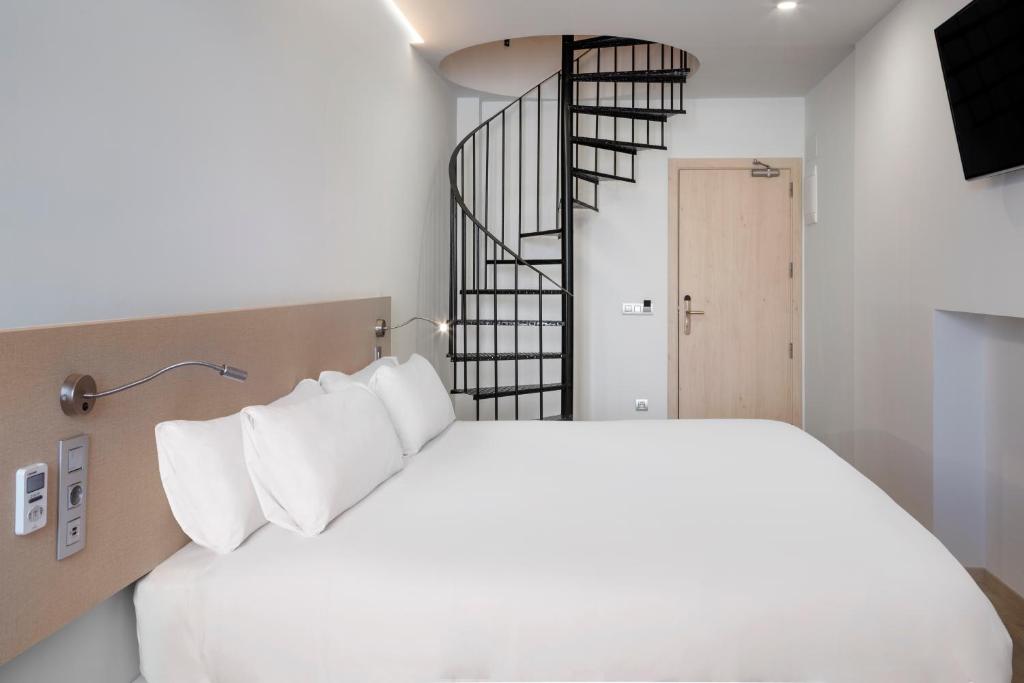 Posteľ alebo postele v izbe v ubytovaní B&B HOTEL Málaga Centro