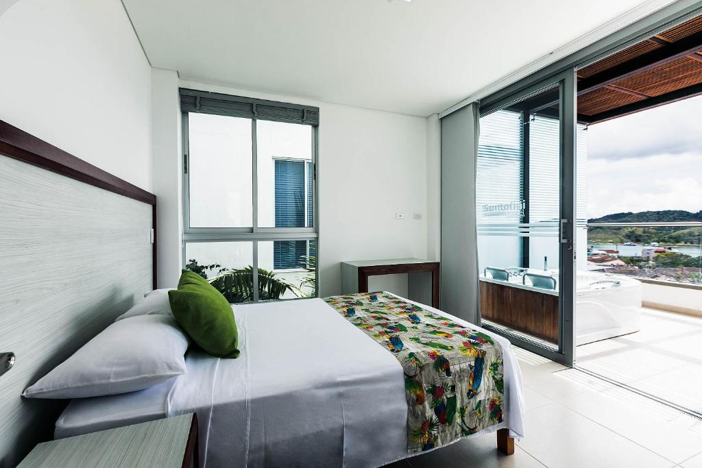Postel nebo postele na pokoji v ubytování Hotel Santorini