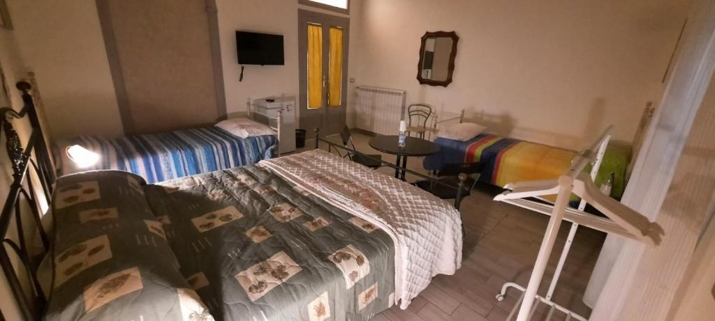 Posteľ alebo postele v izbe v ubytovaní Le Stanze di Ginevra 2-Santa Maria a Vico-
