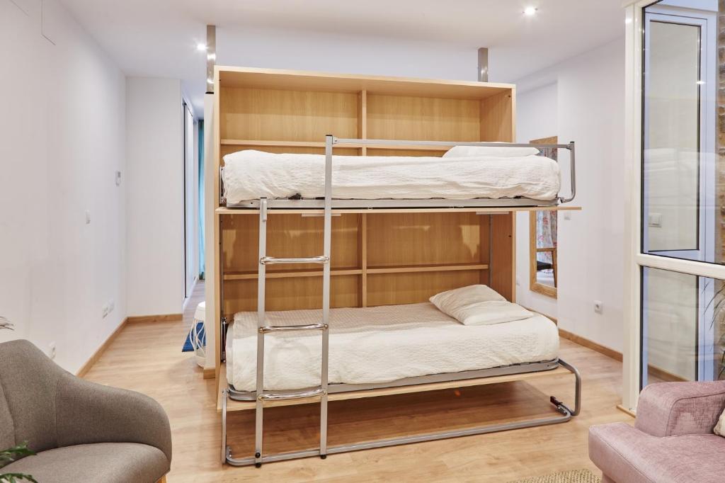 Posteľ alebo postele v izbe v ubytovaní Apartamentos Orfas