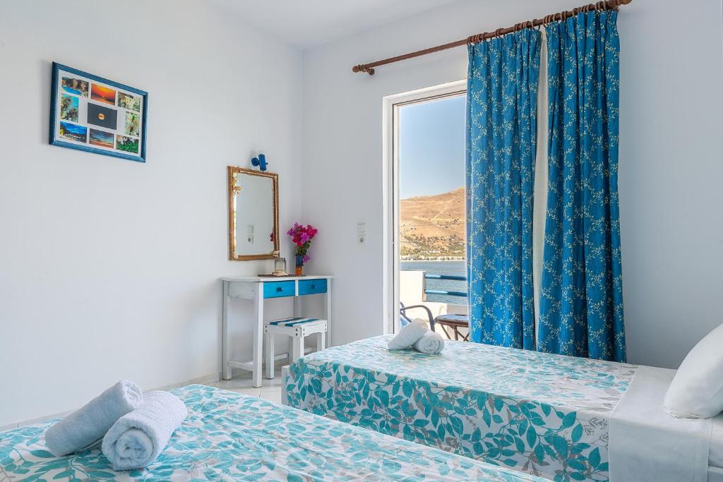 Postel nebo postele na pokoji v ubytování Antoniadi Rooms