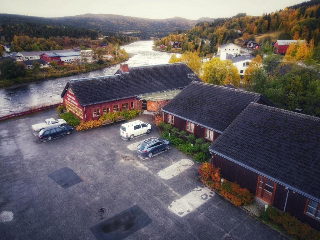 an aerial view of a building with cars parked in a parking lot at Malmplassen Gjestegård Bed & Breakfast in Tolga