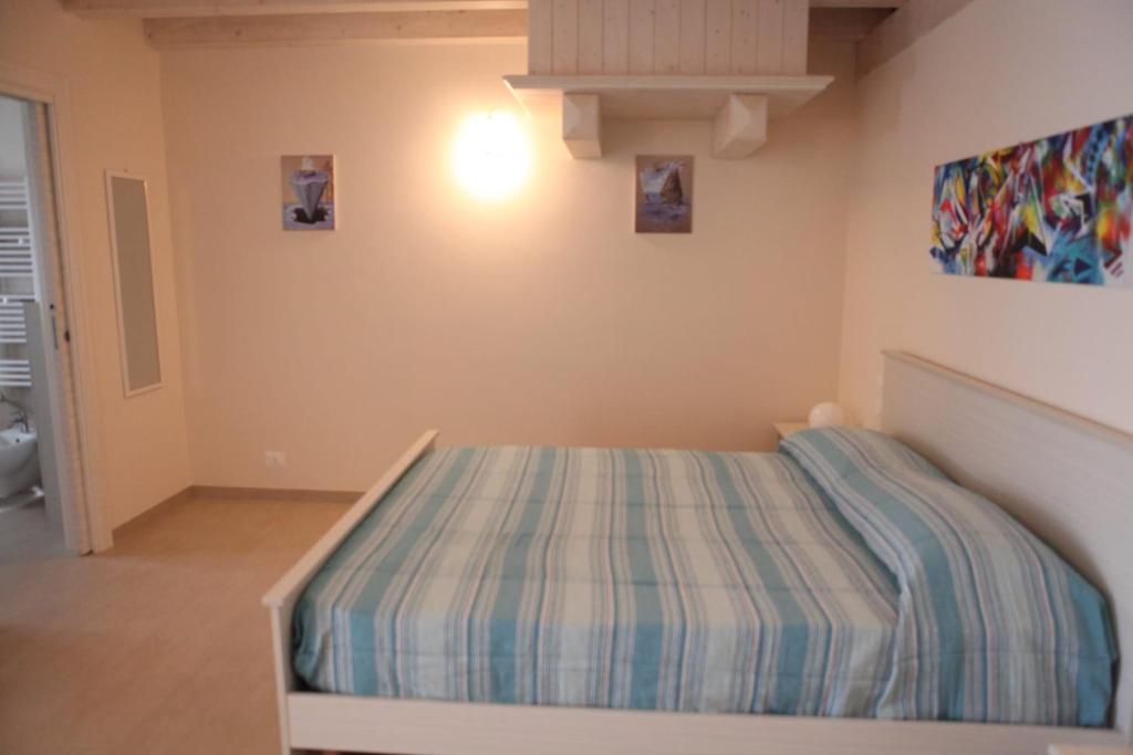 Postel nebo postele na pokoji v ubytování B&B ARCOBALENO