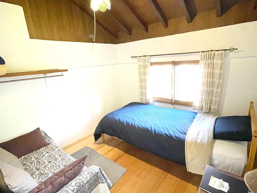 Tempat tidur dalam kamar di Gallery HARA & GUESTHOUSE - Vacation STAY 90971v