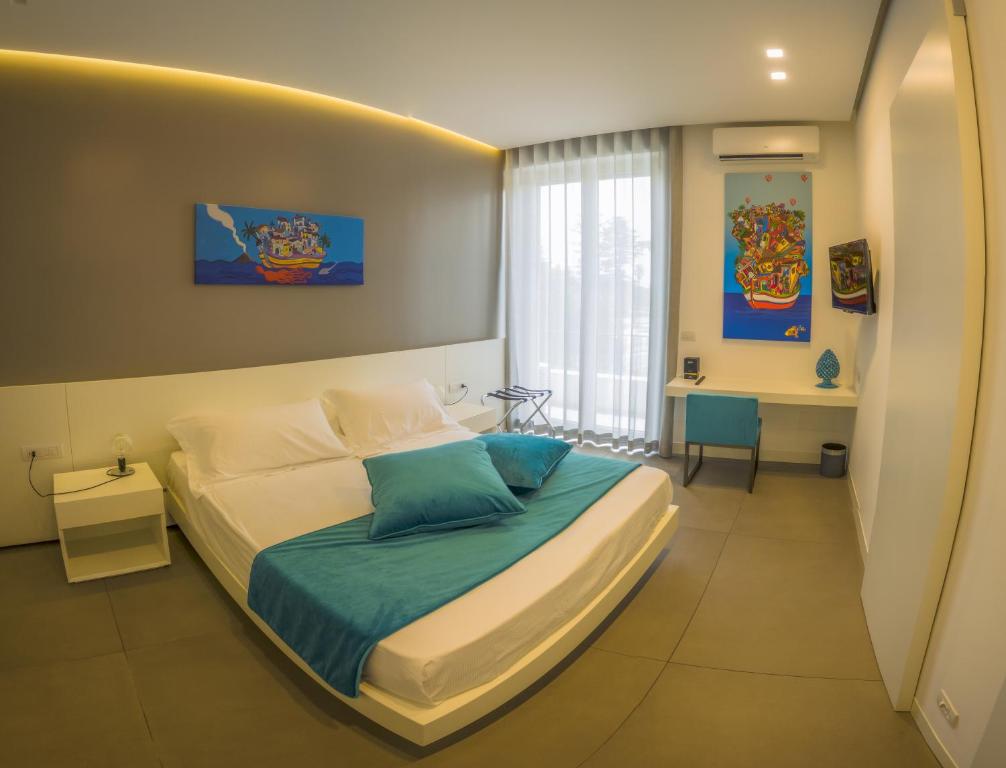 Postel nebo postele na pokoji v ubytování FuoriSquadra B&B